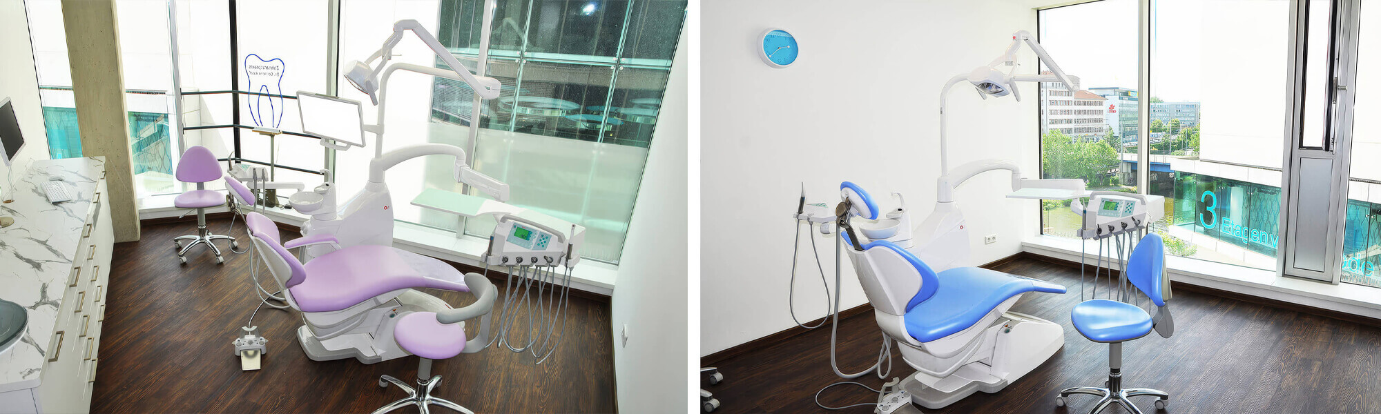 Zahnarztbehandlungsraum mit lila-weißer Behandlungseinheit, weißer Arbeitszeile und großem Fenster mit Blick auf die Stadt